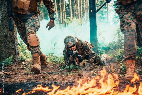 Modern warfare soldiers surrounded by fire fight in dense and dangerous forest areas