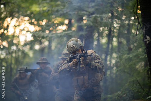 Photography A group of modern warfare soldiers is fighting a war in dangerous remote forest areas