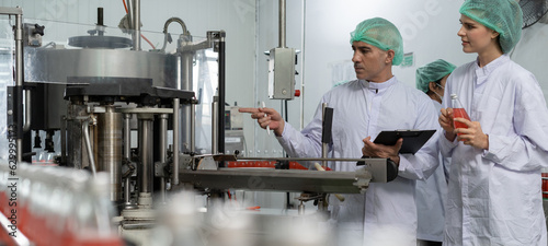 Portrait quality supervisor or food or beverages technician inspection about quality control food or beverages before send product to the customer. Production leader recheck ingredient.