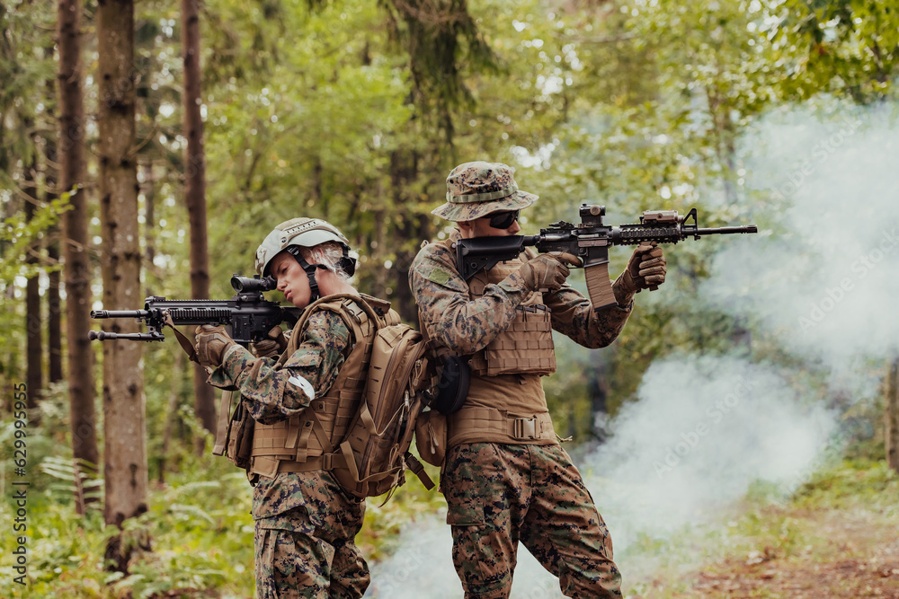 Fototapeta premium Modern Warfare Soldiers Squad Running in Tactical Battle Formation Woman as a Team Leader