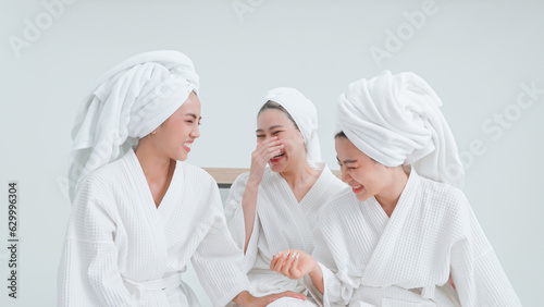 Group of women in bathrobes having fun after bathing.