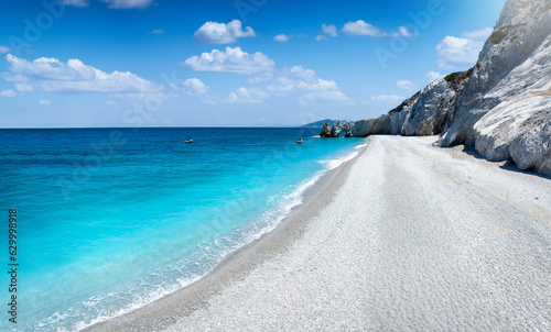 Fototapeta Naklejka Na Ścianę i Meble -  The impressive beach of Lalaria, Skiathos island, Sporades, Greece, with light gray pebble stones and turquoise, shining sea