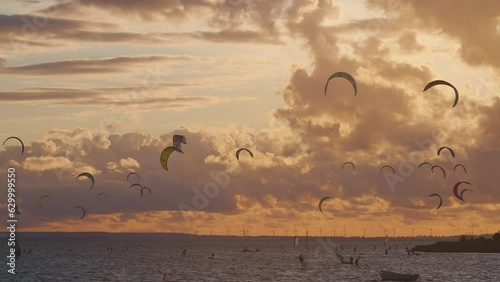 professional kite surfing on ocean or sea sunset, kitesurfing training at water