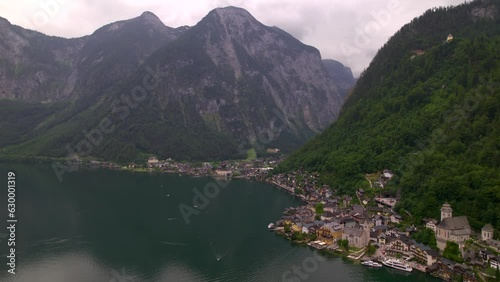 Stunning Austrian mountains from a bird's-eye view. Fascinating blue lake, green mountain forests. Mountain towns. Roads for travel.