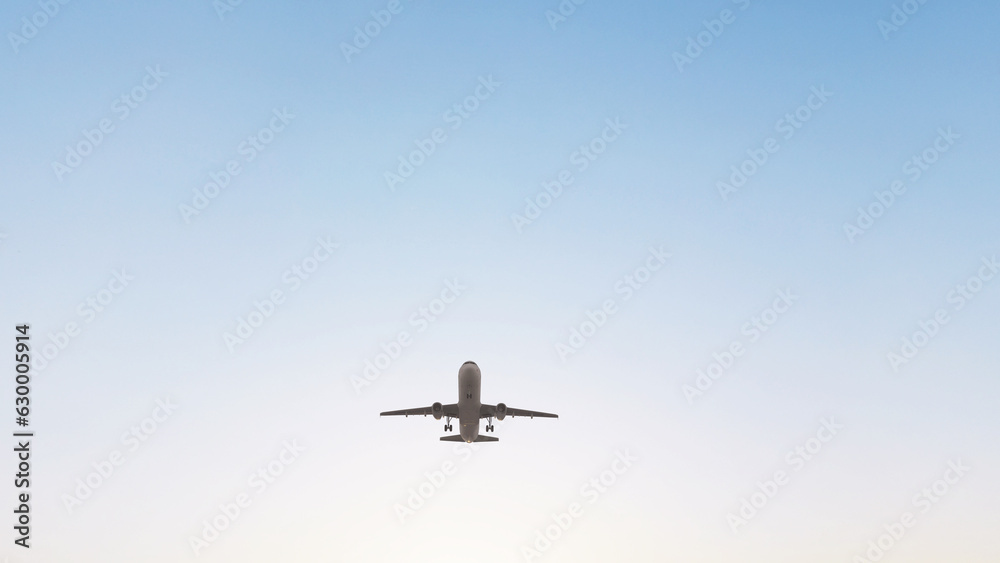 Airplane in the sky at sunset. Air transportation. Travel. Airplane Takes Off Against the Background of Blue Sky. Airplane in the sky at sunset. Air transportation. Travel. Airplane Takes Off Against the Background of Blue Sky.