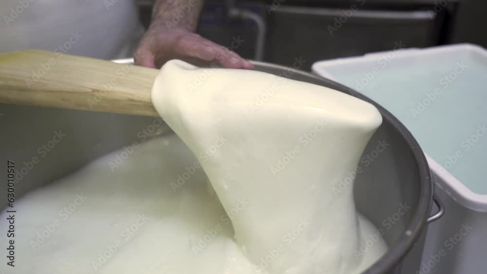 Process of making cheese from milk in a saucepan by a cook
