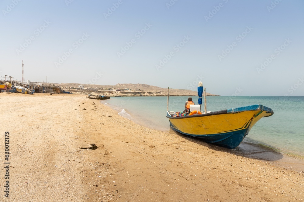 A Boat on the Shore of a Beach on Hengam Island, Near Qeshm Island in Iran.