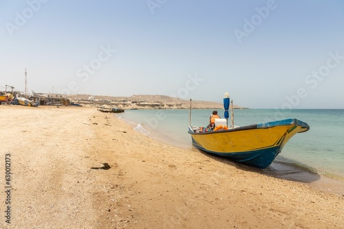 A Boat on the Shore of a Beach on Hengam Island  Near Qeshm Island in Iran.