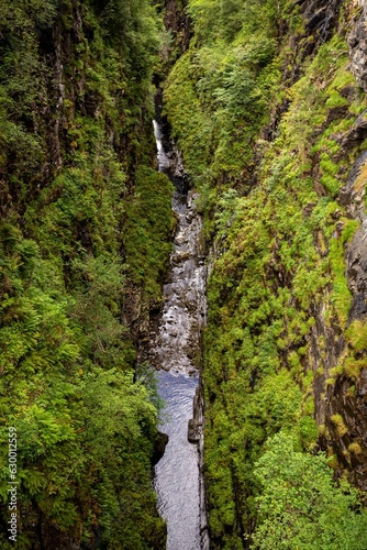 Stunning aerial view of the lush green canyon of Corrieshalloch Gorge in Scotland photo