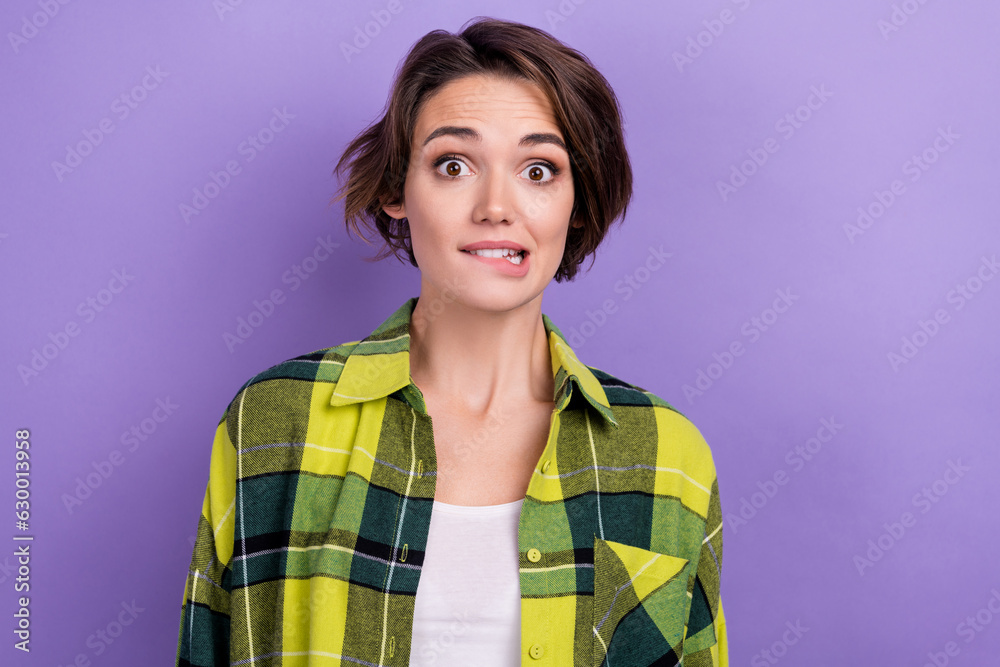 Portrait of worried puzzled funky lady teeth biting lips wear plaid outfit isolated on pastel purple color background Portrait of worried puzzled funky lady teeth biting lips wear plaid outfit isolated on pastel purple color background