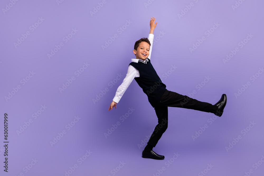 photo of positive cheerful pupils dancing on first september school day isolated purple color background