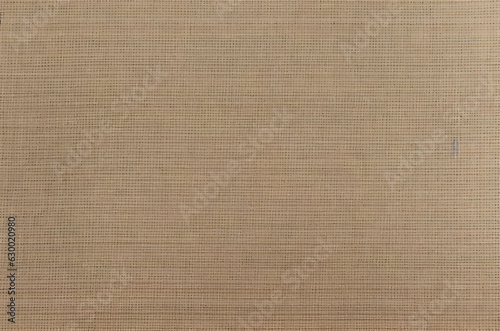 'Light beige, cream, and brown color woven texture pattern background in jute hessian sackcloth canvas