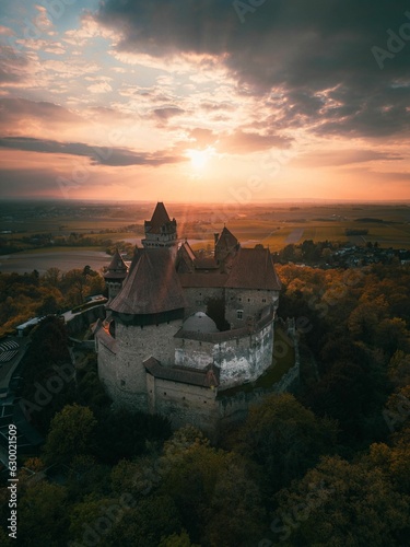 Aerial shot of an ancient Kreuzenstein castle at vibrant sunset - Lower Austria photo