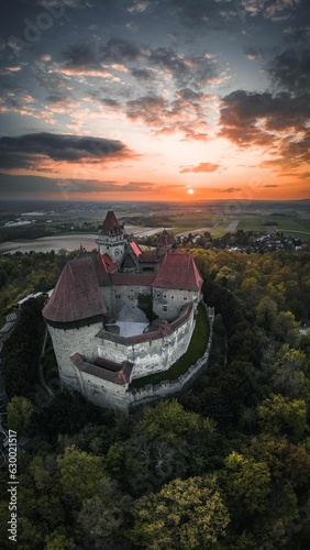 Aerial shot of an ancient Kreuzenstein castle at vibrant sunset - Lower Austria photo