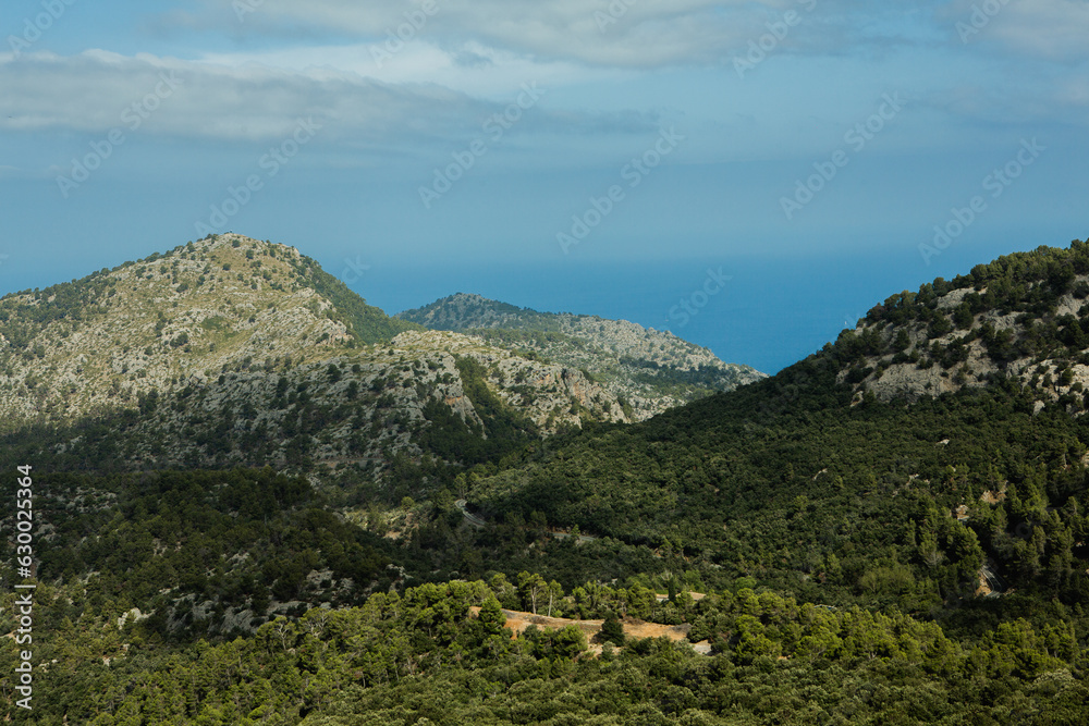 Obraz premium Hiking holidays Mallorca, Spain. Beautiful picture with landscape of Serra de Tramuntana mountains in the island of Majorca in Mediterranean sea. Paradise for bikers. Adventure travel.