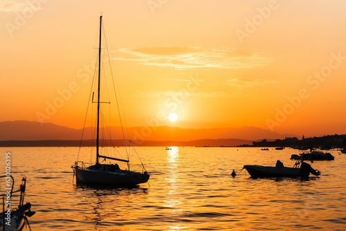 Beautiful orange sunset and tranquil water  in Selce, Croatia