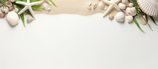 White sand frame adorned with eucalyptus leaves, seashells, and a starfish, featuring a cord for hanging.