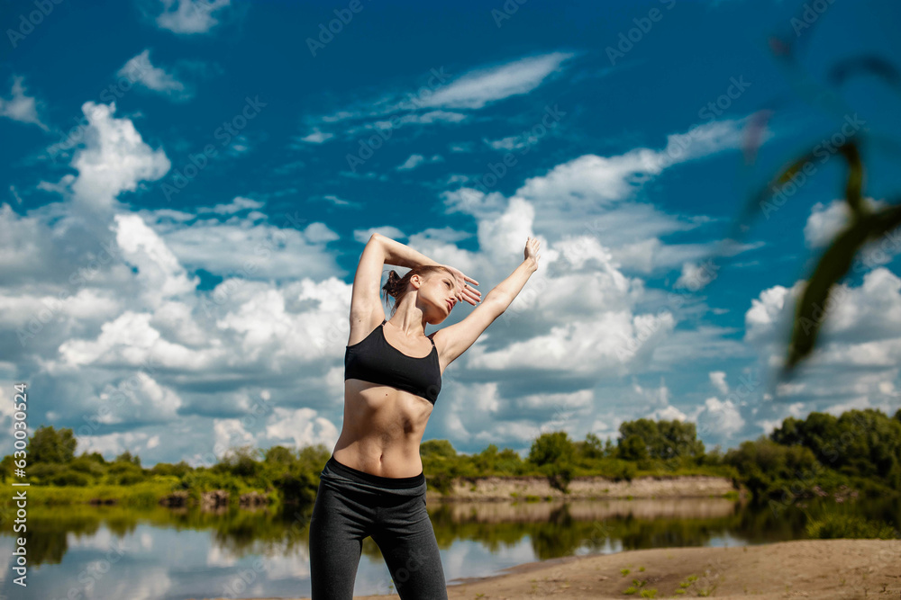 beautiful sexy woman in sportswear is exercising outdoors in summer. Sports fitness woman in nature. beautiful sexy woman in sportswear is exercising outdoors in summer. Sports fitness woman in nature.