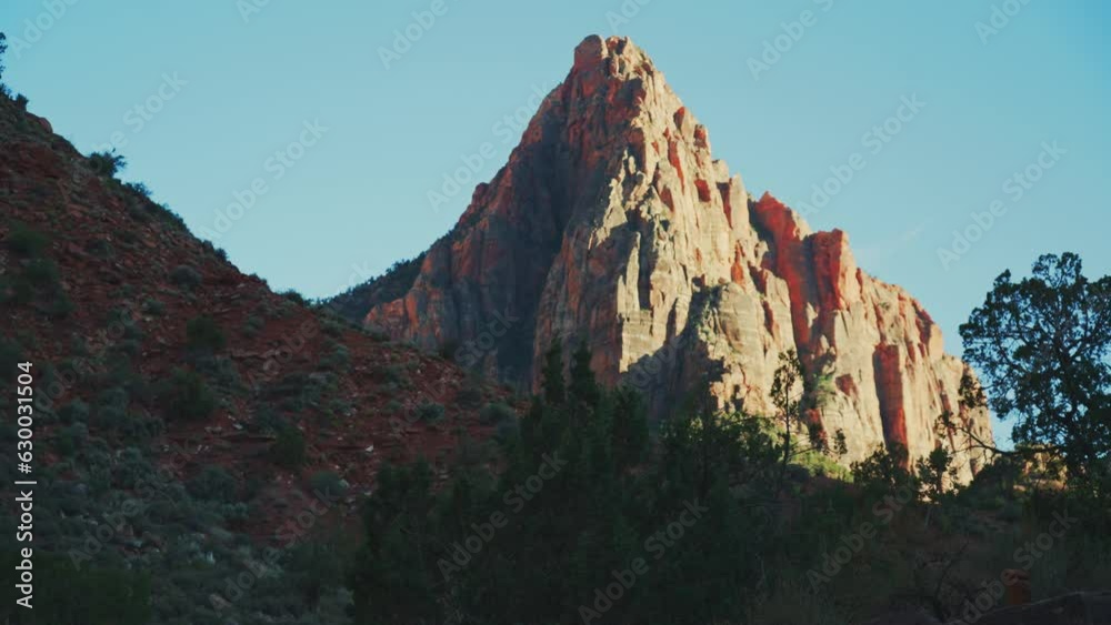 Beautiful view of the rough cliffs under a clear blue sky at the Zion National Park Beautiful view of the rough cliffs under a clear blue sky at the Zion National Park