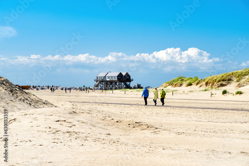 Fototapeta Naklejka Na Ścianę i Meble -  People hiking to the beach in Sankt Peter Ording, North Sea, Germany