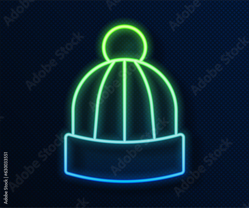 Glowing neon line Winter hat icon isolated on blue background. Vector