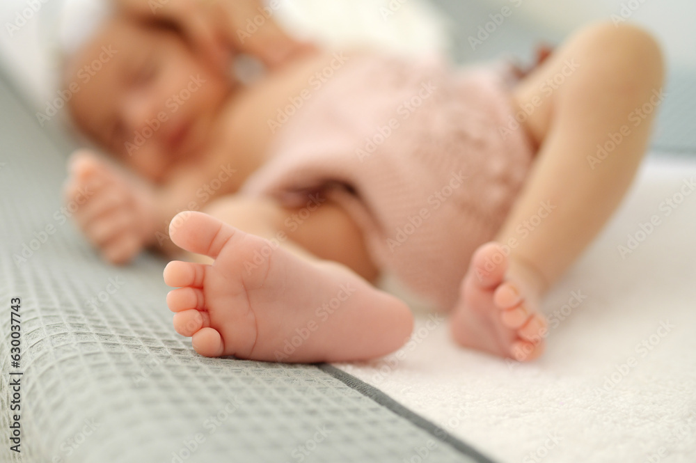 Newborn baby lying on bed Newborn baby lying on bed