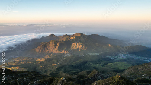 The beautiful Landscape view from Lawu Mountain at sunrise located in Magetan. One of the most beautiful mountains in Java with an altitude of 3265m above sea level.  © syahrir
