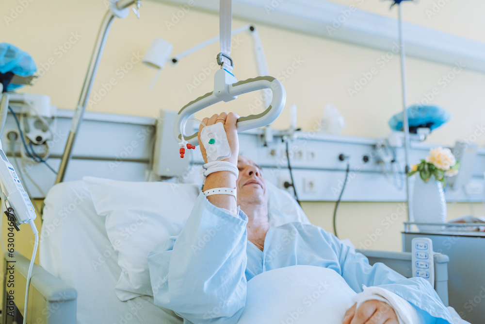 Male patient after injury or surgery in hospital ward Male patient after injury or surgery in hospital ward
