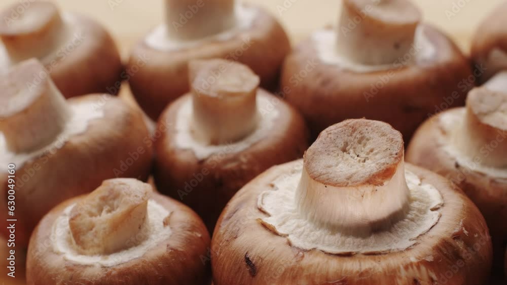 Freshly picked mushrooms on home kitchen, close up texture of brown Champignon, woman cooking tasty vegan dinner. Freshly picked mushrooms on home kitchen, close up texture of brown Champignon, woman cooking tasty vegan dinner.