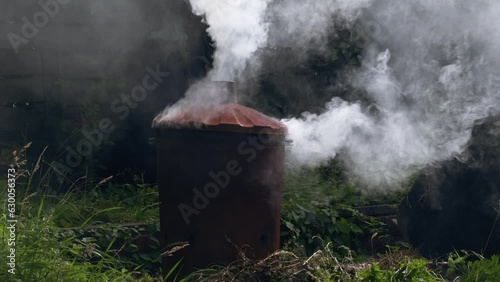 Garden and house garbage burning in a bin incinerator