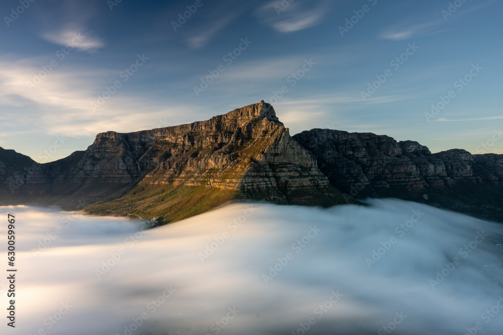custom made wallpaper toronto digitalView of morning fog over Table Mountain during a dramatic sunrise, Cape Town, South Africa.