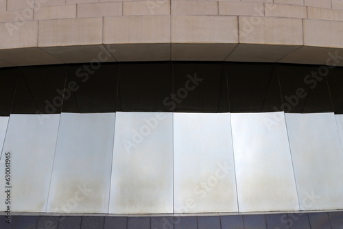 Abstract fragment of modern architecture, glass and concrete walls.