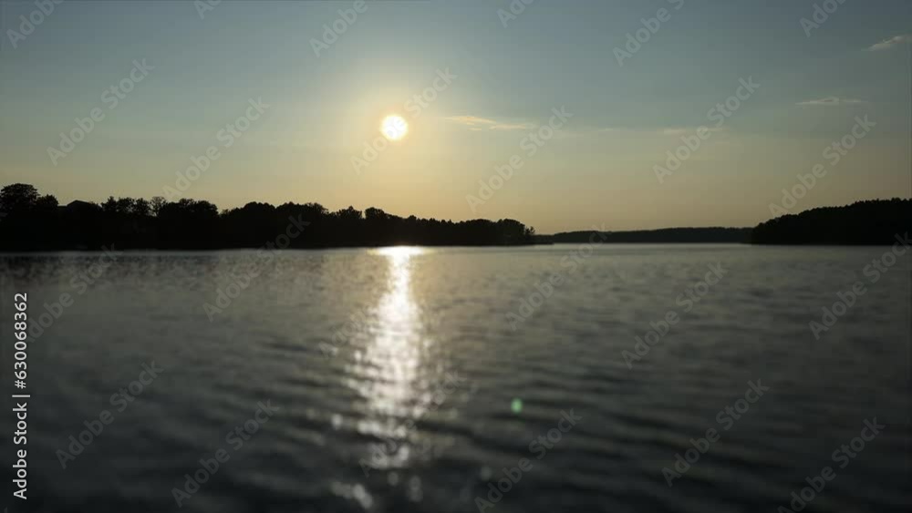 Sunset over the lake in summer. Time to relax by the water Sunset over the lake in summer. Time to relax by the water