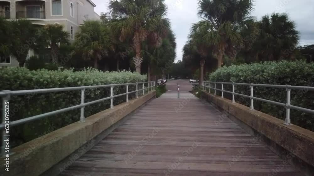 walking back on the fishing pier at Jungle Low Tide at Prada de Narvaez Park in St. Petersburg, FL. POV walking back on the fishing pier at Jungle Low Tide at Prada de Narvaez Park in St. Petersburg, FL. POV