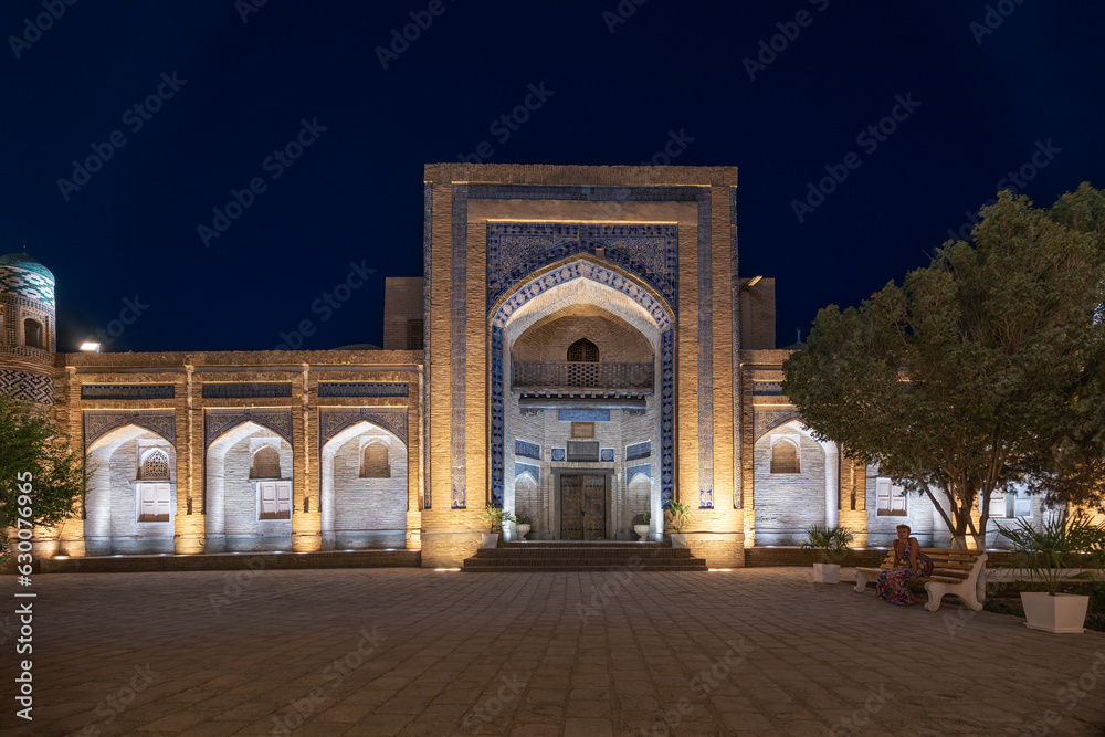 Matniyaz Divanbegi Madrasah facade illuminated at night in old city Ichan Kala, Khiva, Uzbekistan Matniyaz Divanbegi Madrasah facade illuminated at night in old city Ichan Kala, Khiva, Uzbekistan