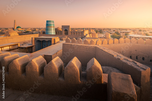 Kalta Minor, madrasah and ancient wall in old city from Kunya Ark citadel at sunset, Khiva, Uzbekistan