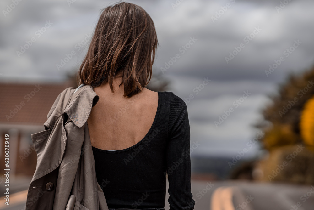 portrait of a style woman walking, enjoys a wonderful atmosphere of a vacation in fall time, wearing beige raincoat portrait of a style woman walking, enjoys a wonderful atmosphere of a vacation in fall time, wearing beige raincoat
