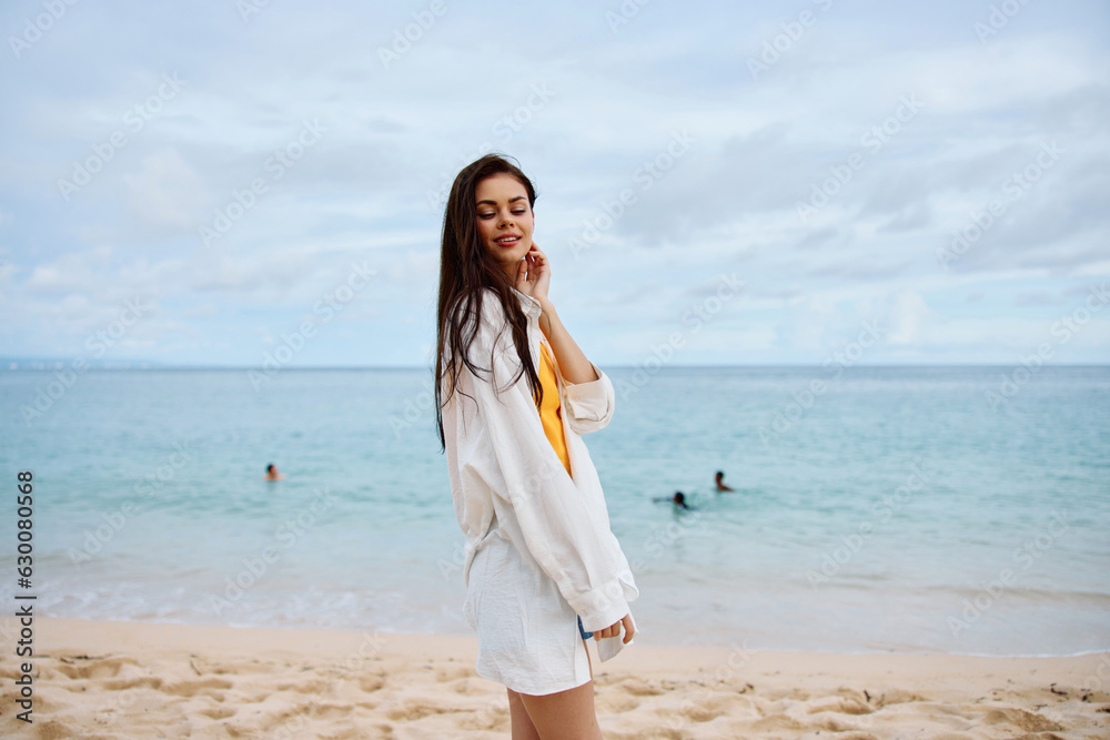 Portrait of a happy woman smile with teeth with long hair brunette summer travel and feeling of freedom, balance Portrait of a happy woman smile with teeth with long hair brunette summer travel and feeling of freedom, balance