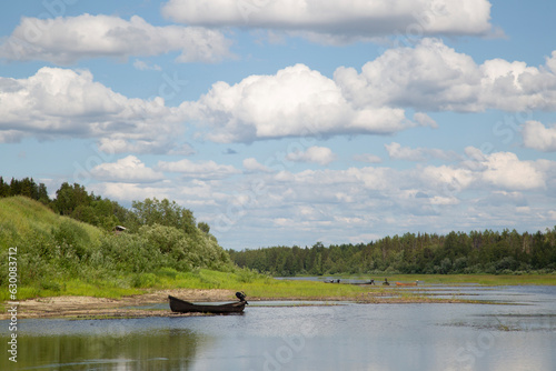 Beautiful summer landscape on the river with clouds.Low-flying clouds.