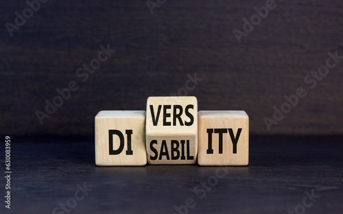 DEI Diversity or disability symbol. Concept words Diversity disability on wooden block. Beautiful grey table grey background. Business diversity disability concept.
