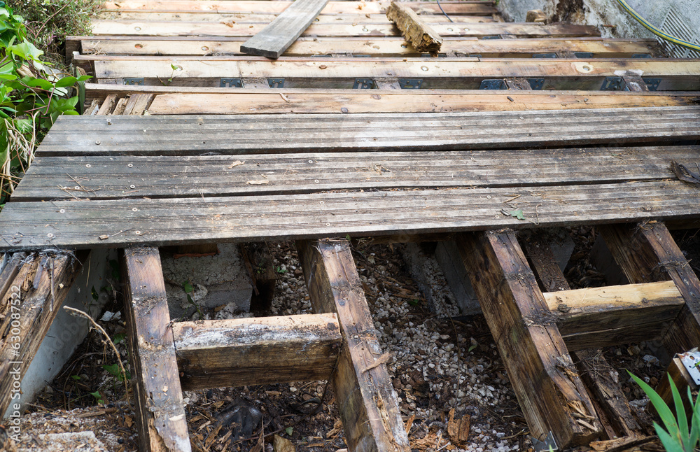 Fototapeta premium Rotten boards of a wooden deck
