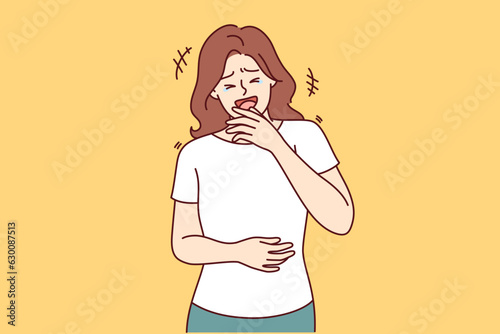 Woman laughs out loud and clutches stomach after hearing new joke on TV show with famous stand-up comedians. Girl laughs hears humorous story from friends or learns about prank on colleagues