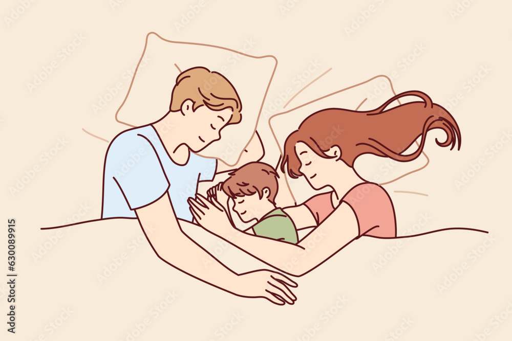 Happy family couple with child sleeps in bed and smiles enjoying healthy sleep and restoring strength after hard day work. Family of man and woman hugging sleeping son lying under blanket
