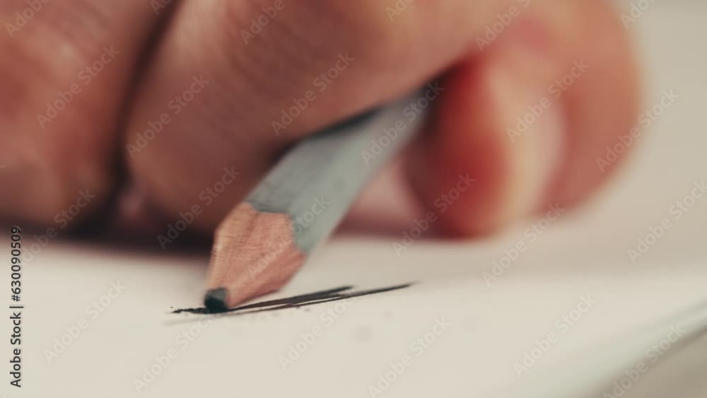 Schizophrenia patient doing a psychological test in a psychiatric clinic. Writing doodle in notebook nervously , shaking hands, tremor. Psychiatry patient hands close up , macro. Schizophrenia patient doing a psychological test in a psychiatric clinic. Writing doodle in notebook nervously , shaking hands, tremor. Psychiatry patient hands close up , macro.