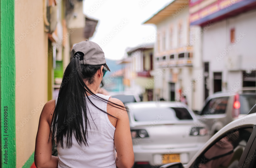 Tourist girl walking through a village Tourist girl walking through a village