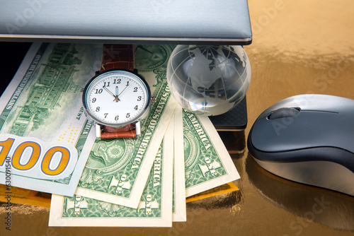 Принти на полотні Dollars, earth globe model, wrist watch near laptop with mouse
