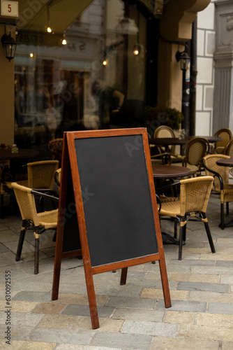 Restaurant sidewalk chalkboard sign board. Old Blak Signboard on the street. Blank store signage sign design mockup isolated