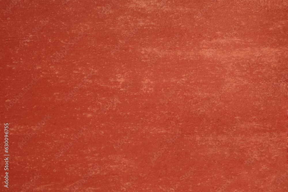 Metallic wall background, texture. Orange or red smooth but unevenly painted surface. The wall and fence sketches. Bright but dark, dingy and gloomy colors. Quick and careless paint application