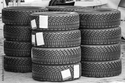 Sets of new high performance gravel rally tires, closeup of modern asymmetric tread pattern