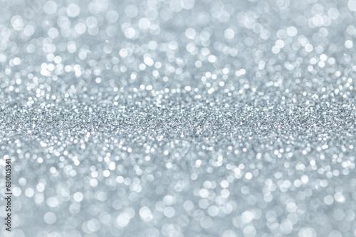 Silver glitter abstract background texture. Full frame. Selective focus